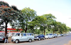 Dozens of cars in a row outside a petrol station