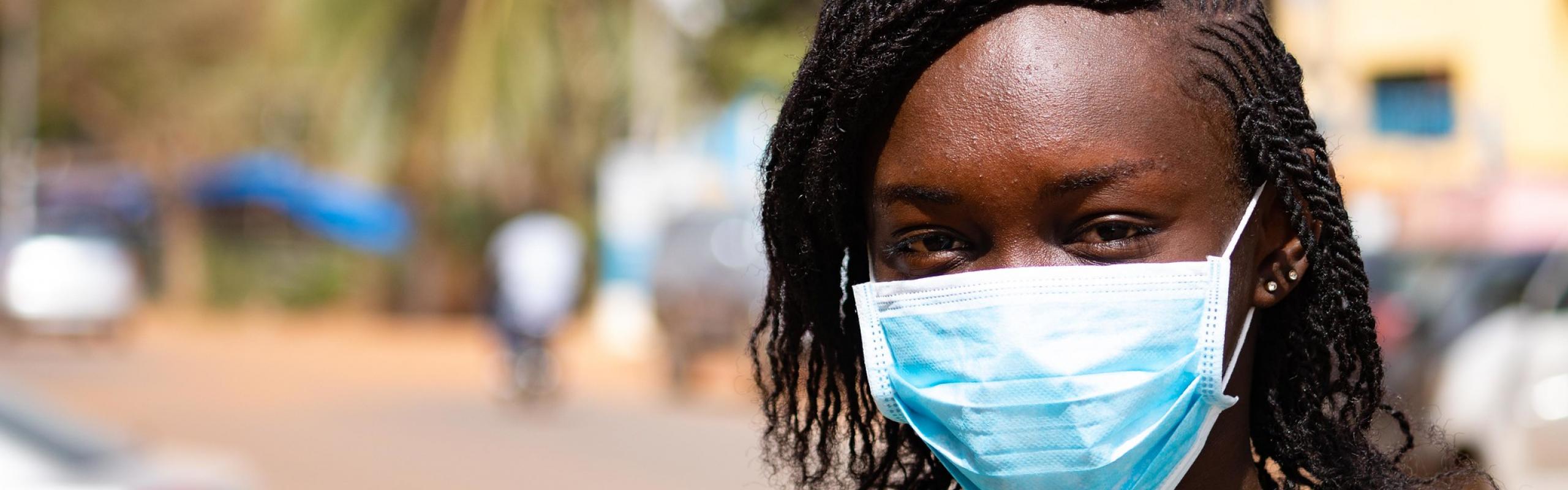 Young Afrian woman wearing face mask