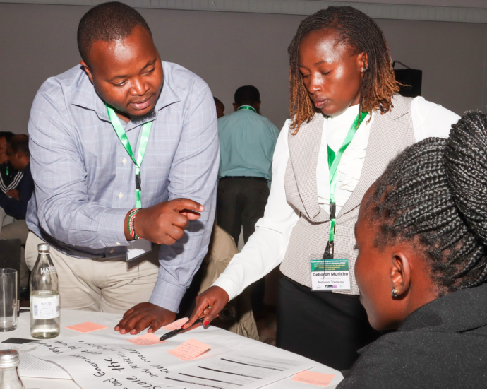 Participants in one of several breakout groups brainstorm legal and governance solutions to address bottlenecks affecting the scale-up of digital financial services for smallholder farmers during the CGIAR Innovation Packages and Scaling Readiness Workshop in Nairobi.