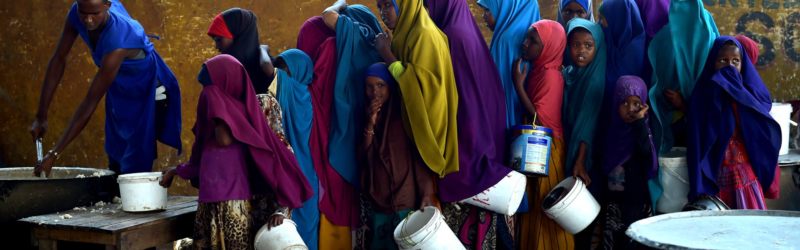 Young girls line up at a feeding centre in Mogadishu.